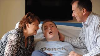 Trish and Grahame Thomas with their son Rhys on his 19th birthday (picture courtesy of dailypost.co.uk)