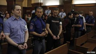 Right wing extremists David Vaculik (L to R), Jaromir Lukes, Ivo Mueller and Vaclav Cojocaru in court in Ostrava where they were convicted of an arson attack