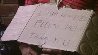 Homeless person sleeping rough on the street