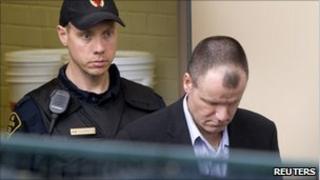 Russell Williams escorted from court
