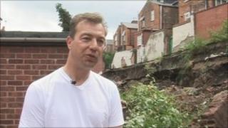 Andrew Pendleton outside his home