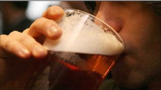 Young man drinking beer
