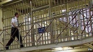 Prison officer walking around a jail