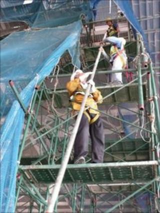 workers building Ford's new plant