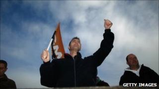Workers from pharmaceutical company Astra Zeneca take part in their latest strike over pension disputes outside the company's production site on October 22, 2010 in Macclesfield, England