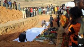 People of Dogo Nahawa, near Jos gather at the scene of a mass burial of their kinsmen killed during a religious crisis (file image from March 8, 2010)