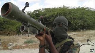 An al-Shabab fighter displays his weapon in northern Mogadishu, Somalia in October 2010