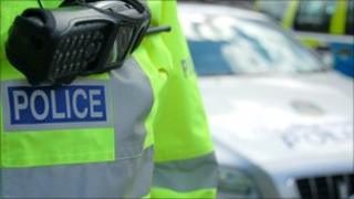 police jacket and car