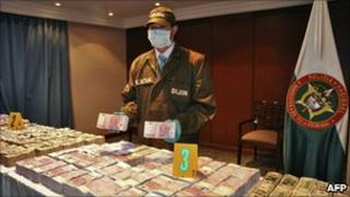 Packets of cash seized by police in Bogota on 5 October, 2010