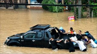 A truck being pushed through flood water on Ko Samui
