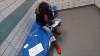 An inmate in a police cell