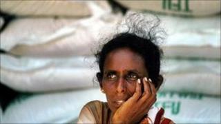 Sri Lanka woman behind rice stockpile