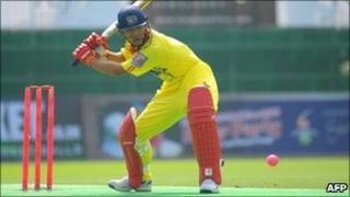 Wang Lei of China watches the ball during a cricket match against the Hong Kong development squad