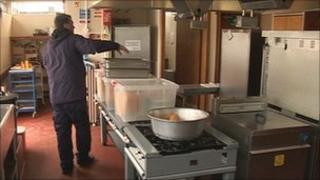 Pre-cooked meals being delivered to school kitchen
