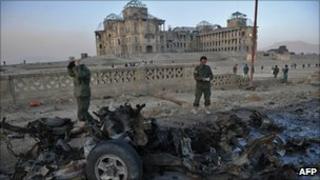Destroyed car in front of the Afghan former royal palace, Kabul (12 Nov 2010)