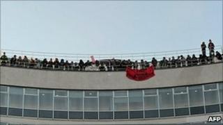 Protesters on the roof at 30 Millbank