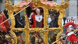 Alderman Michael Bear waving from his coach