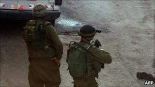 Israeli forces in Hebron detain Palestinians during an operation - October 2010
