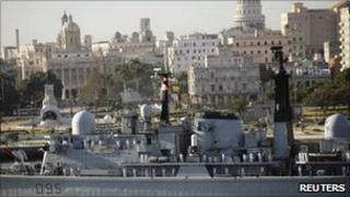 Sailors stand on the deck of British Navy HMS Manchester Type 42 Destroyer as it enters Havana's Harbour