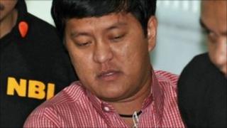 National Bureau Investigation (NBI) agents escort Andal Ampatuan Jnr (C), the prime suspect in the country's worst political massacre, inside a court in Manila (file photo)