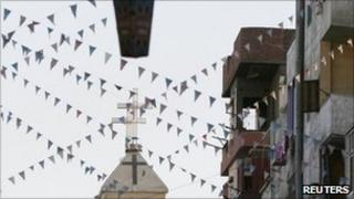 An Egyptian Coptic Orthodox church is seen beneath a decorated lantern in the town of Nagaa Hamady, in Qena, southern Egypt