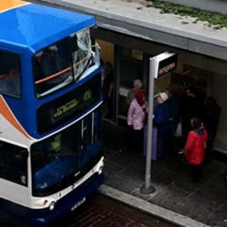 Bus at post office with broken top window