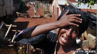 A woman mourns a relative killed in a suburb of Conakry