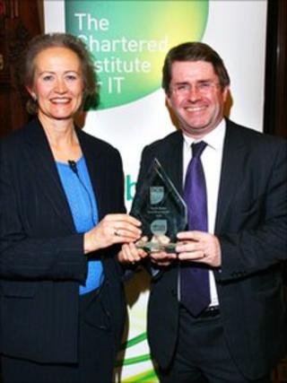 Elizabeth Sparrow, President of BCS, the Chartered Institute for IT, presents Kevin Brennan MP with his social media award