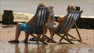An elderly couple on a beach
