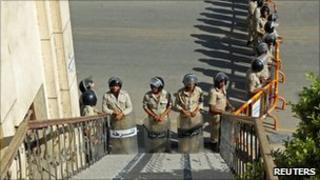 Riot police form a line as members and supporters from the banned Muslim Brotherhood opposition group gather to support their candidates for the upcoming parliamentary elections in Fayoum on 4 November 2010