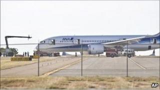 The Dreamliner is examined by emergency services and investigators.