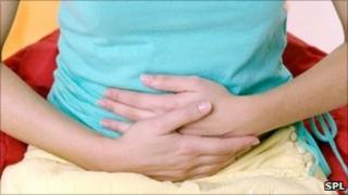 Hands over abdomen