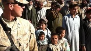 US marine (left) with Afghan schoolchildren, Marjah