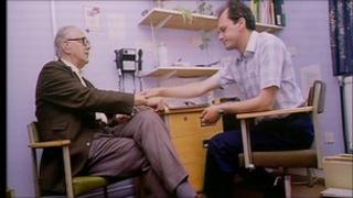 Dr in GP surgery talking to a patient