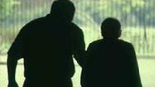Older person in silhouette