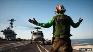 US personnel aboard the USS George Washington in the Sea of Japan