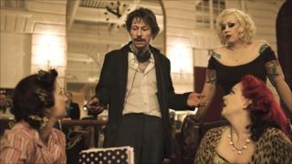 (from left) Suzanne Ramsey as Kitten on the Keys, Mathieu Amalric directing, Miranda Colclasure as Mimi Le Meaux, Linda Marraccini as Dirty Martini