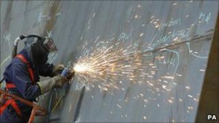 Builder works on the one of the two new aircraft carriers due to enter service in 2020