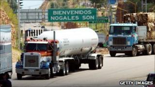 Mexican trucks cross the US border by Sonora, Mexico.