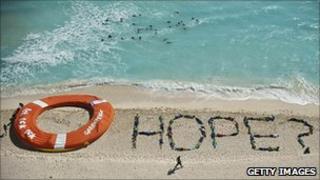 Environment campaigners staging a demonstration on the beach at Cancun (Image: AFP/Getty Images)