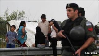 A member of the National Gendarmerie stands guard at Indoamericano Park in Villa Soldati neighbourhood