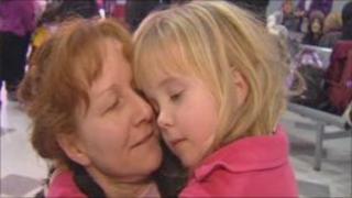 Child arriving home at Cardiff airport