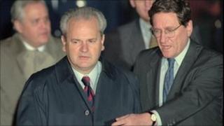Then Assistant Secretary of State Richard Holbrooke, right, escorts Serbian President Slobodan Milosevic across the tarmac at Wright-Patterson Air Force Base in Dayton, Ohio, on 31 October 1995
