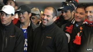 Chilean miner Mario Sepulveda (centre) reacts with fellow miners