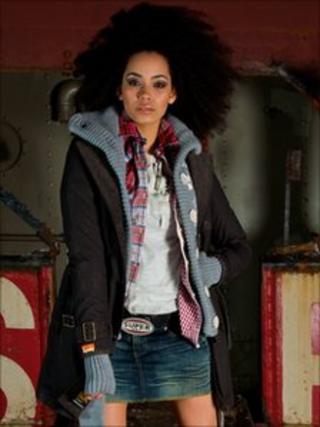 Model sporting a Superdry belt buckle