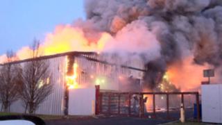 Flames from the fire at the industrial estate.