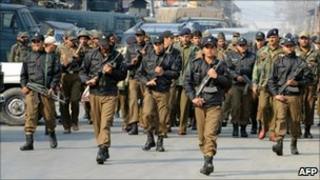 Indian policemen patrol near Srinagar, Indian-administered Kashmir, in November 2010