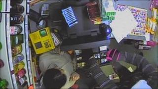 Robber stealing from till