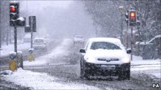 A car in Edinburgh as snow and icy conditions hit central Scotland