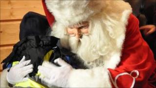 Santa Claus and child